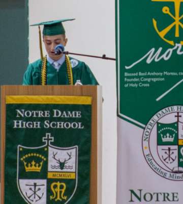 student speaking at graduation